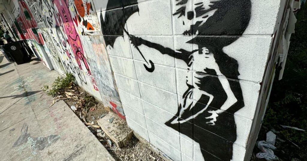 Is Banksy back in town?  A similar painting on a wall in New Orleans causes a stir